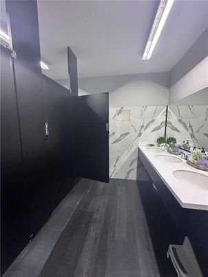Bathroom, Dual Sink Vanities, Interior, Marble Walls, Wood Texture Flooring