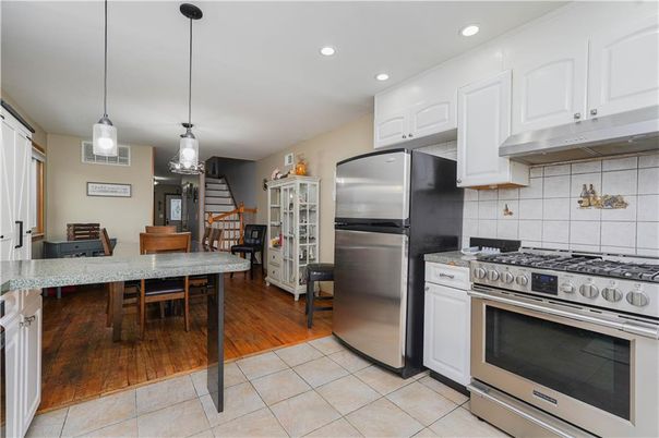 Dining room, Interior, Kitchen, Pendant Lights, Recessed Lighting, Stainless Steel Appliances, Wood Texture Flooring