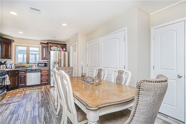 Dining room, Interior, Kitchen, Recessed Lighting, Stainless Steel Appliances, Wood Texture Flooring