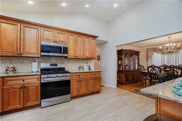Chandelier, Dining room, Interior, Kitchen, Recessed Lighting, Stainless Steel Appliances, Wood Texture Flooring