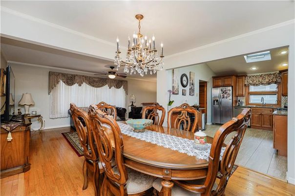 Chandelier, Dining room, Interior, Kitchen, Recessed Lighting, Stainless Steel Appliances, Wood Texture Flooring