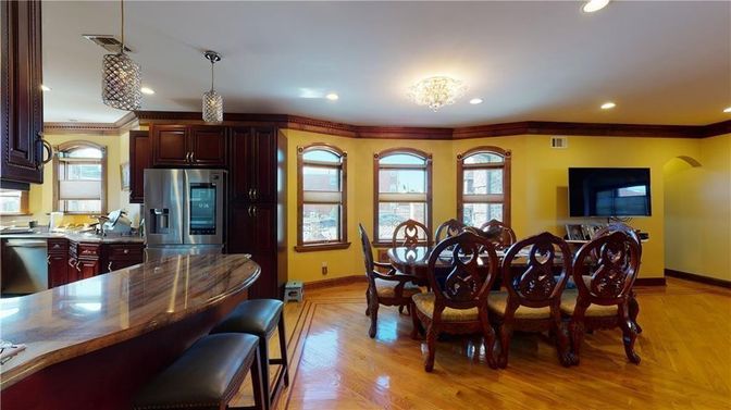 Chandelier, Dining room, Interior, Kitchen, Pendant Lights, Recessed Lighting, Stainless Steel Appliances, Wood Texture Flooring