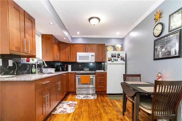 Dining room, Interior, Kitchen, Recessed Lighting, Stainless Steel Appliances, Wood Texture Flooring