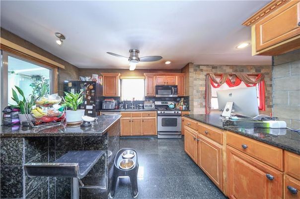 Interior, Kitchen, Recessed Lighting, Stainless Steel Appliances, Stone Walls