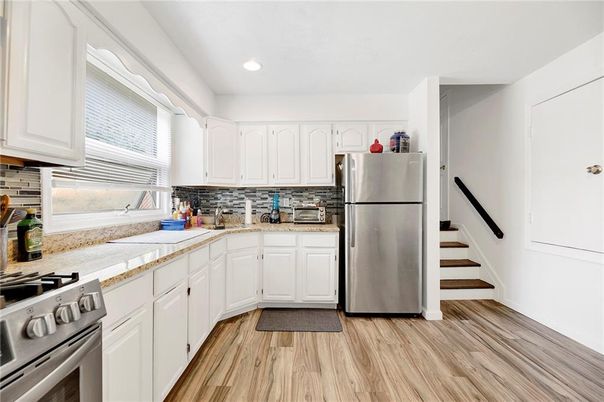 Interior, Kitchen, Recessed Lighting, Stainless Steel Appliances, Wood Texture Flooring