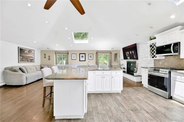 Fireplace, Interior, Kitchen, Living room, Recessed Lighting, Stainless Steel Appliances, Wood Texture Flooring