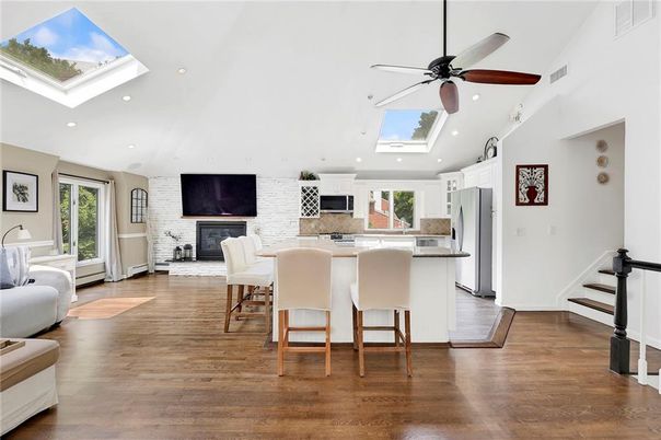 Dining room, Fireplace, Interior, Kitchen, Recessed Lighting, Stone Walls, Wood Texture Flooring