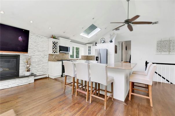 Fireplace, Interior, Kitchen, Recessed Lighting, Stone Walls, Wood Texture Flooring