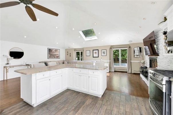Fireplace, Interior, Kitchen, Living room, Recessed Lighting, Stainless Steel Appliances, Wood Texture Flooring