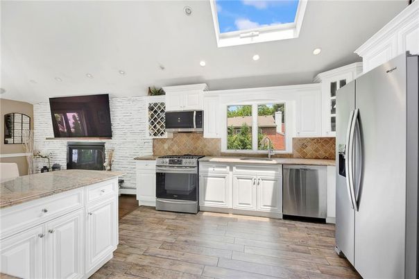 Interior, Kitchen, Recessed Lighting, Stainless Steel Appliances, Stone Walls, Wood Texture Flooring