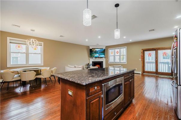 Dining room, Fireplace, Interior, Kitchen, Pendant Lights, Recessed Lighting, Wood Texture Flooring