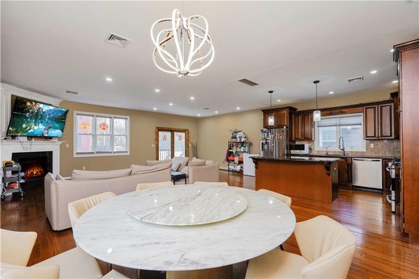 Dining room, Fireplace, Interior, Kitchen, Living room, Pendant Lights, Recessed Lighting, Stainless Steel Appliances, Wood Texture Flooring