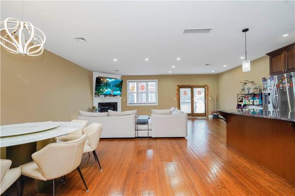 Dining room, Fireplace, Interior, Living room, Pendant Lights, Recessed Lighting, Wood Texture Flooring