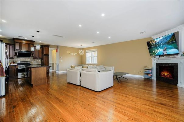 Fireplace, Interior, Kitchen, Living room, Pendant Lights, Recessed Lighting, Stainless Steel Appliances, Wood Texture Flooring