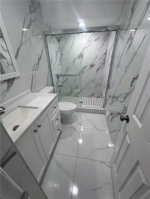 Bathroom, Dual Sink Vanities, Interior, Marble, Marble Walls, Recessed Lighting