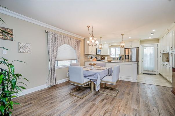 Dining room, Interior, Kitchen, Pendant Lights, Recessed Lighting, Stainless Steel Appliances, Wood Texture Flooring