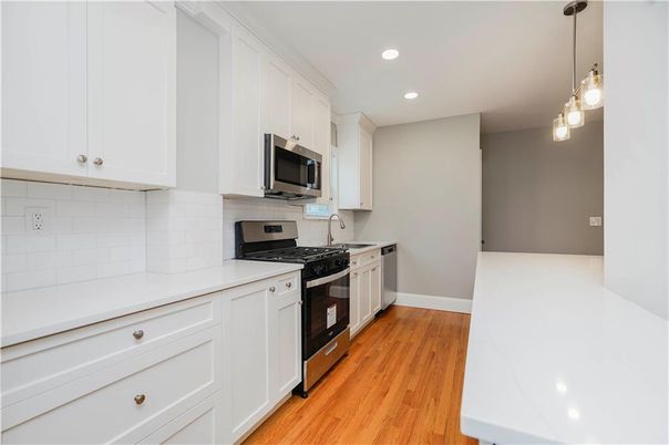 Interior, Kitchen, Pendant Lights, Recessed Lighting, Stainless Steel Appliances, Wood Texture Flooring