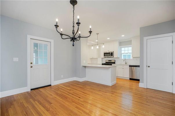 Chandelier, Interior, Kitchen, Pendant Lights, Recessed Lighting, Stainless Steel Appliances, Wood Texture Flooring