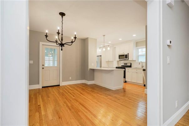 Chandelier, Interior, Kitchen, Pendant Lights, Recessed Lighting, Stainless Steel Appliances, Wood Texture Flooring