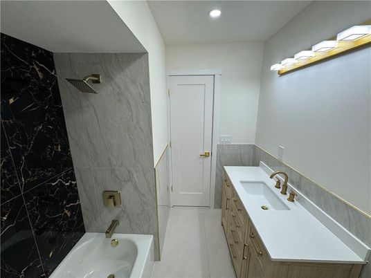 Bathroom, Dual Sink Vanities, Interior, Marble Walls, Recessed Lighting