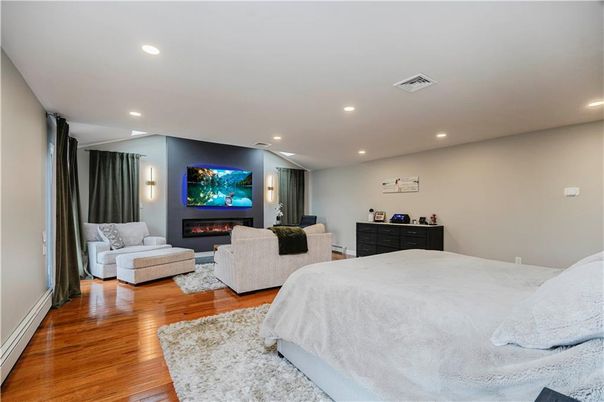 Bedroom, Fireplace, Interior, Recessed Lighting, Wood Texture Flooring