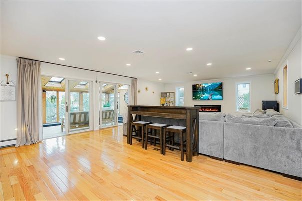 Fireplace, Interior, Living room, Piano, Recessed Lighting, Wood Texture Flooring