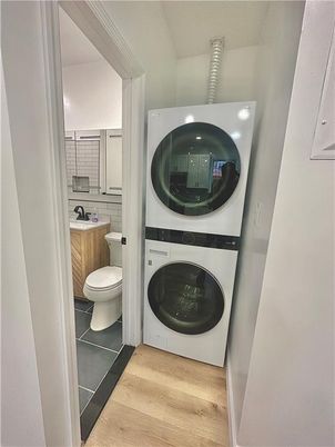 Bathroom, Interior, Utility Closets, Washer, Wood Texture Flooring