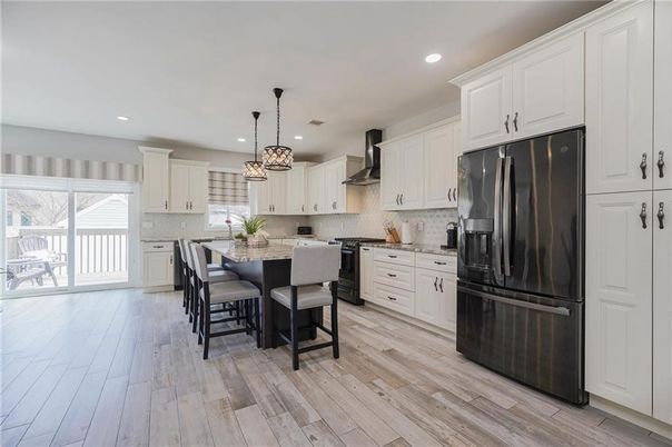 Chandelier, Dining room, Interior, Kitchen, Pendant Lights, Recessed Lighting, Stainless Steel Appliances, Wood Texture Flooring