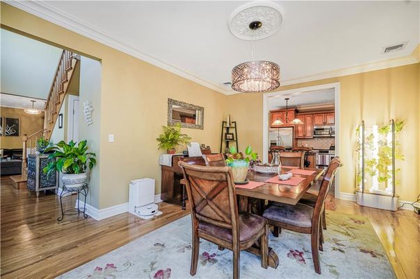Chandelier, Dining room, Interior, Kitchen, Pendant Lights, Stainless Steel Appliances, Wood Texture Flooring
