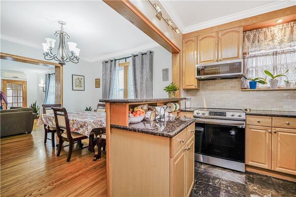 Chandelier, Dining room, Interior, Kitchen, Stainless Steel Appliances, Wood Texture Flooring