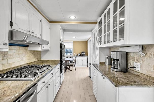 Dining room, Interior, Kitchen, Recessed Lighting, Stainless Steel Appliances, Wood Texture Flooring