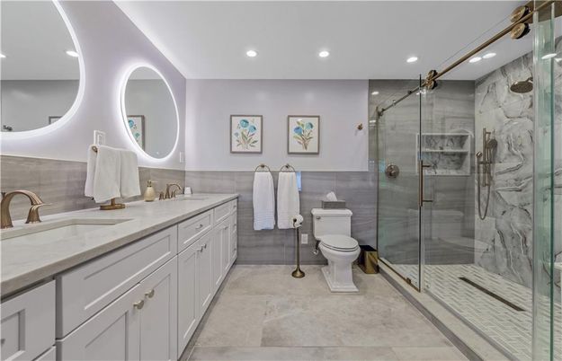 Bathroom, Dual Sink Vanities, Glass Shower, Interior, Marble Walls, Recessed Lighting