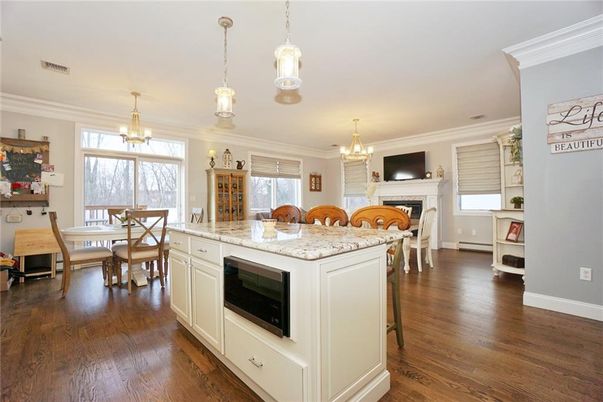 Chandelier, Dining room, Fireplace, Interior, Kitchen, Pendant Lights, Wood Texture Flooring