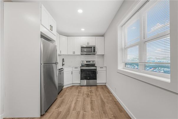 Interior, Kitchen, Recessed Lighting, Stainless Steel Appliances, Wood Texture Flooring