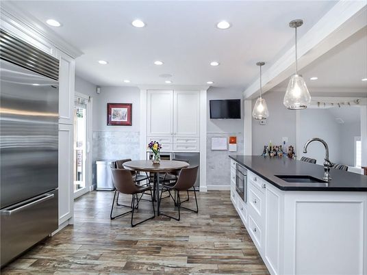 Dining room, Interior, Kitchen, Pendant Lights, Recessed Lighting, Stainless Steel Appliances, Wood Texture Flooring