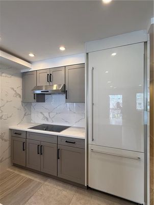 Interior, Kitchen, Marble Walls, Recessed Lighting, Stainless Steel Appliances, Wood Texture Flooring