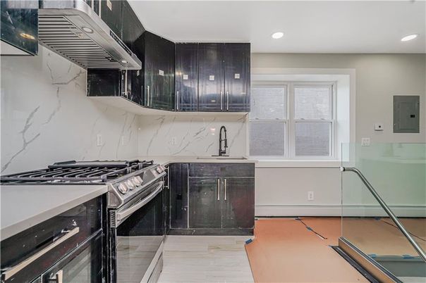 Interior, Kitchen, Marble Walls, Recessed Lighting, Stainless Steel Appliances