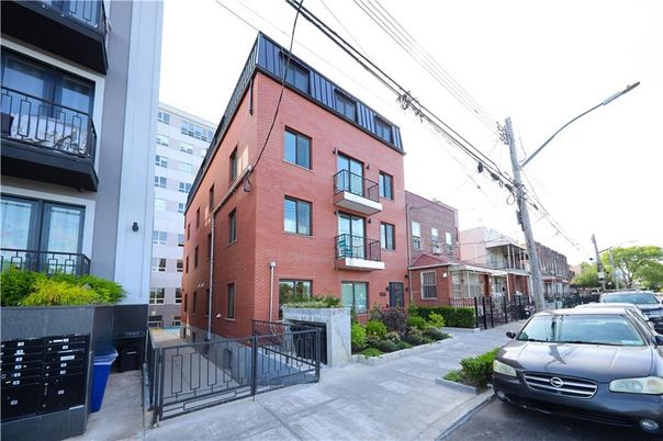 Exterior, Facade, Brick Facade, Condo Building