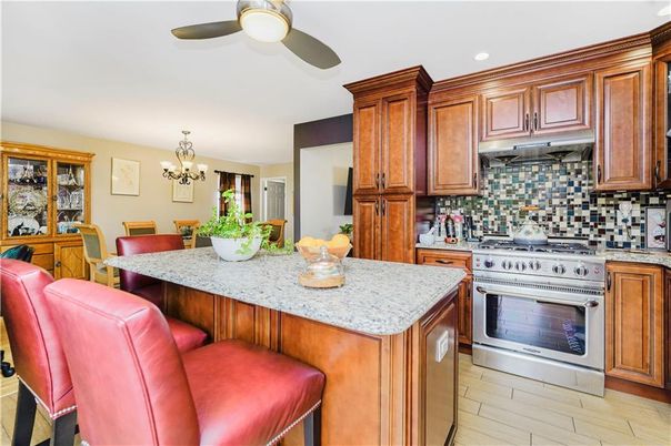 Chandelier, Dining room, Interior, Kitchen, Recessed Lighting, Stainless Steel Appliances, Wood Texture Flooring