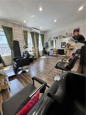 Fitness Equipment, Interior, Living room, Recessed Lighting, Stone Walls, Wood Texture Flooring
