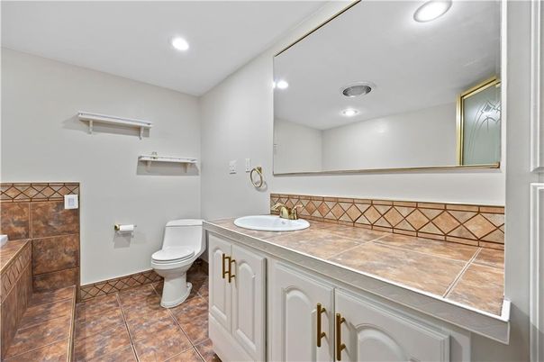 Bathroom, Dual Sink Vanities, Interior, Recessed Lighting, Tile Countertops