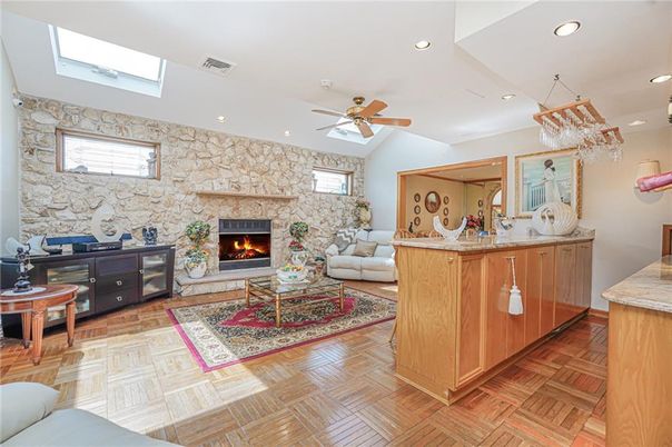 Fireplace, Interior, Living room, Recessed Lighting, Stone Walls, Wood Texture Flooring