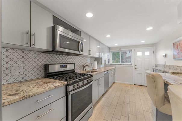 Interior, Kitchen, Recessed Lighting, Stainless Steel Appliances, Wood Texture Flooring