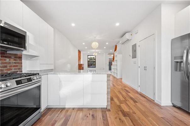 Chandelier, Interior, Kitchen, Recessed Lighting, Stainless Steel Appliances, Wood Texture Flooring