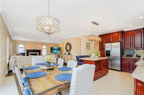 Chandelier, Dining room, Fireplace, Interior, Kitchen, Living room, Recessed Lighting, Stainless Steel Appliances