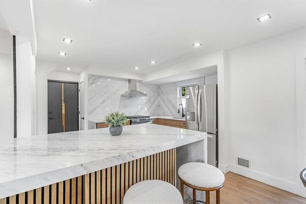 Interior, Kitchen, Marble Walls, Recessed Lighting, Stainless Steel Appliances, Wood Texture Flooring
