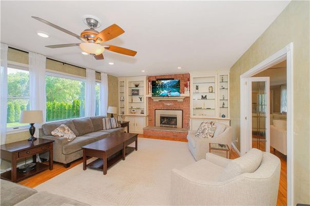 Fireplace, Interior, Living room, Recessed Lighting, Stone Walls, Wood Texture Flooring