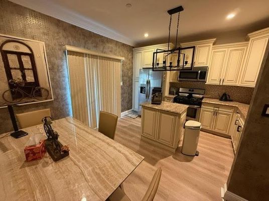 Chandelier, Dining room, Interior, Kitchen, Pendant Lights, Recessed Lighting, Stainless Steel Appliances, Wood Texture Flooring