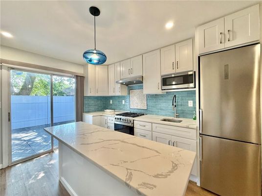 Interior, Kitchen, Pendant Lights, Recessed Lighting, Stainless Steel Appliances, Wood Texture Flooring