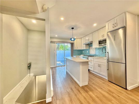 Interior, Kitchen, Pendant Lights, Recessed Lighting, Stainless Steel Appliances, Wood Texture Flooring